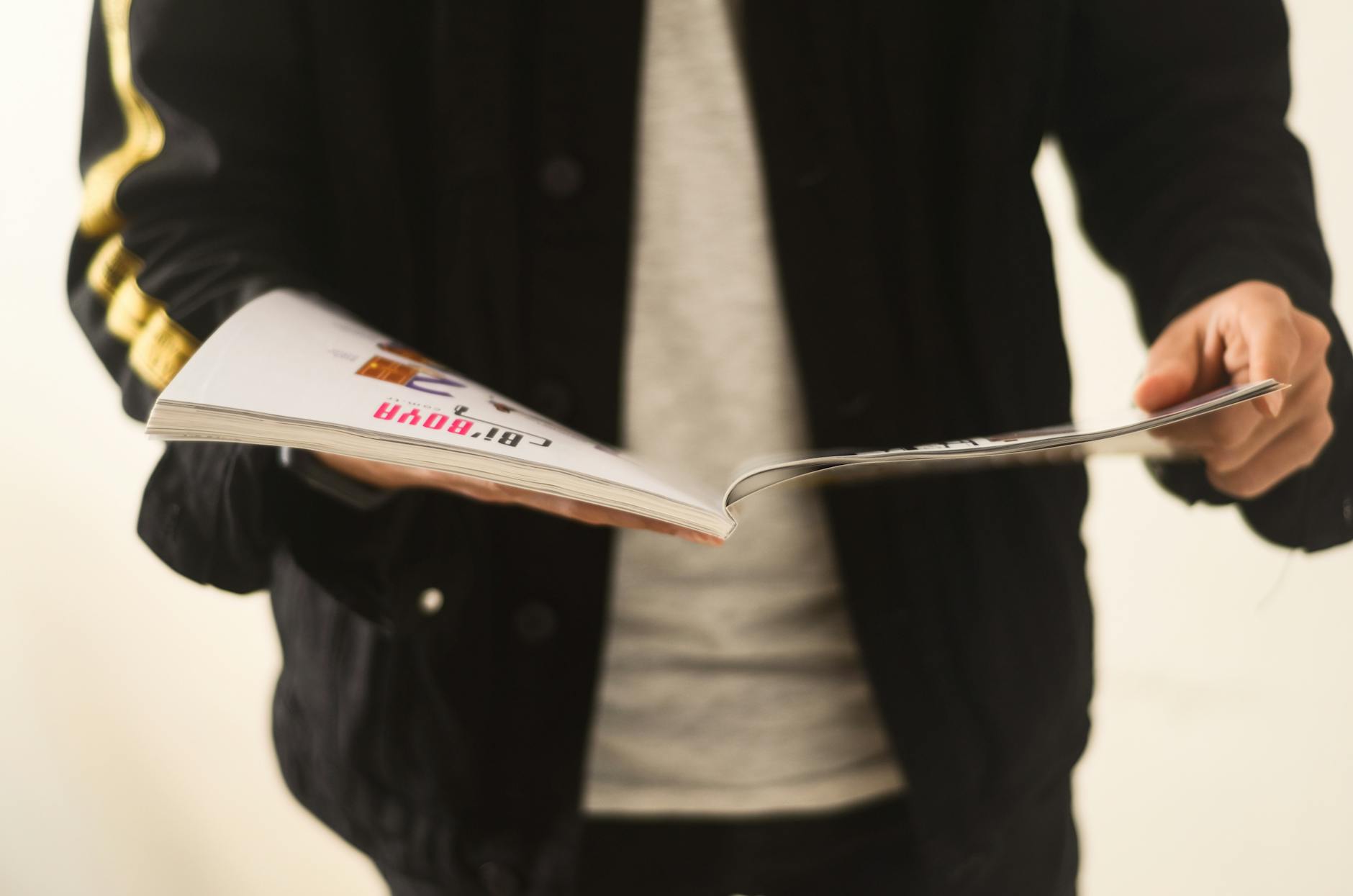 person reading magazine